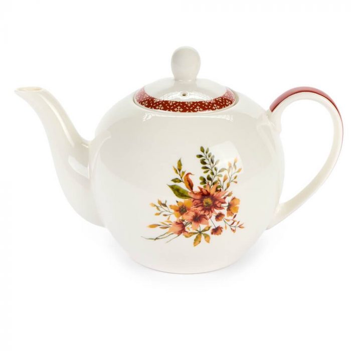 Théière blanche avec fleurs